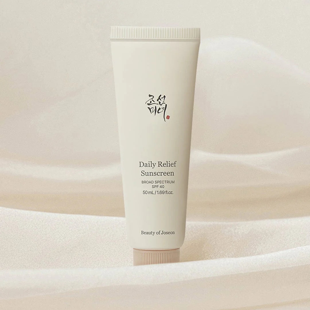 Tube of Daily Relief Sunscreen on a soft beige background