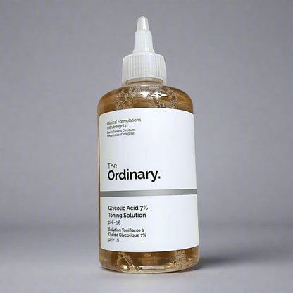 Bottle of 'The Ordinary' Glycolic Acid 7% Toning Solution on a beige fabric background